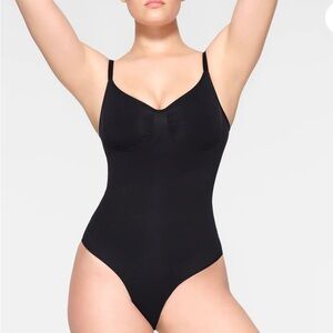 SKIMS seamless sculpting brief bodysuit. L/XL. Black. New in box.  Adjustable.